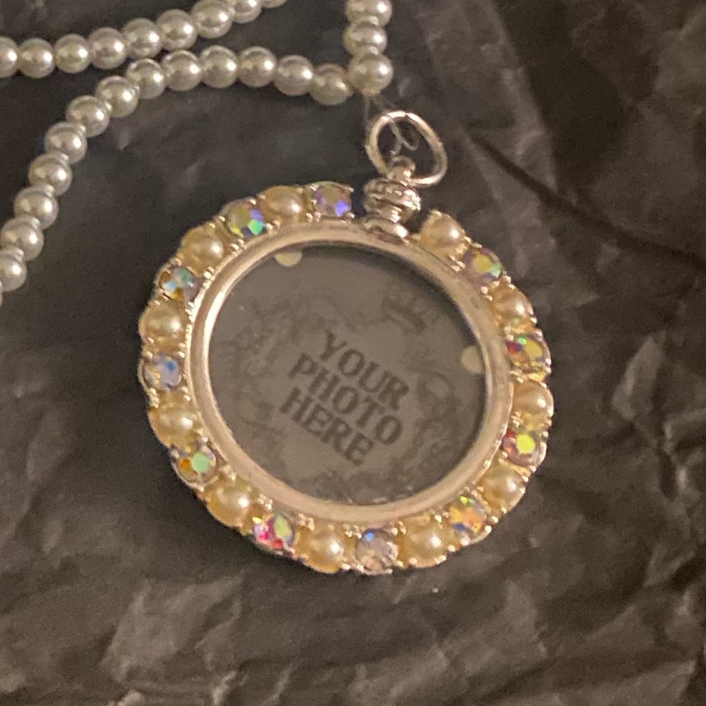 3 For $13
NolaAngel Designs long pearl necklace with picture pendant - Picture 3 of 3